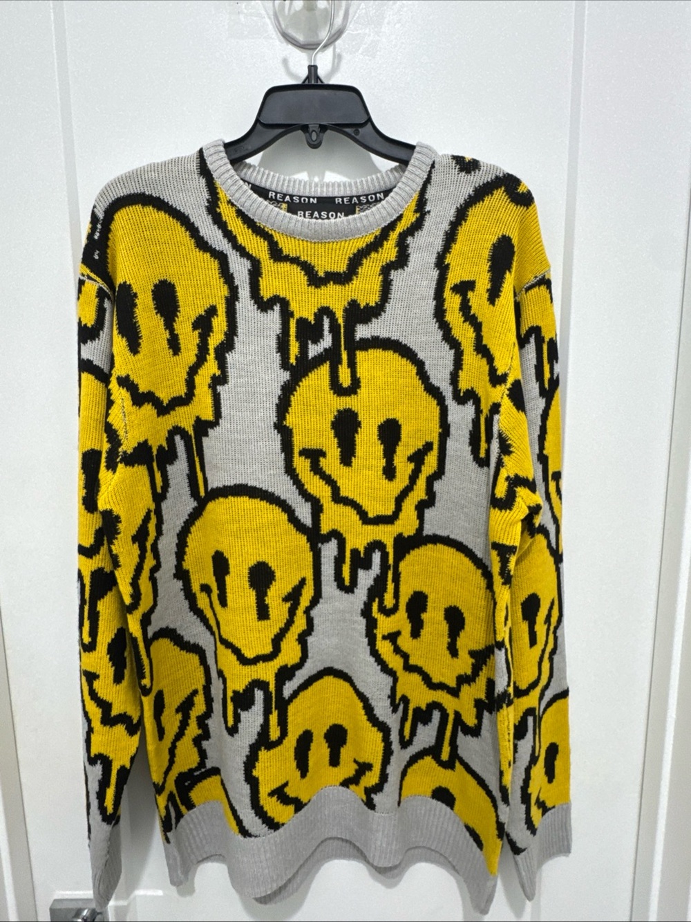 Reason Clothing melting smiley face sweater in Size L